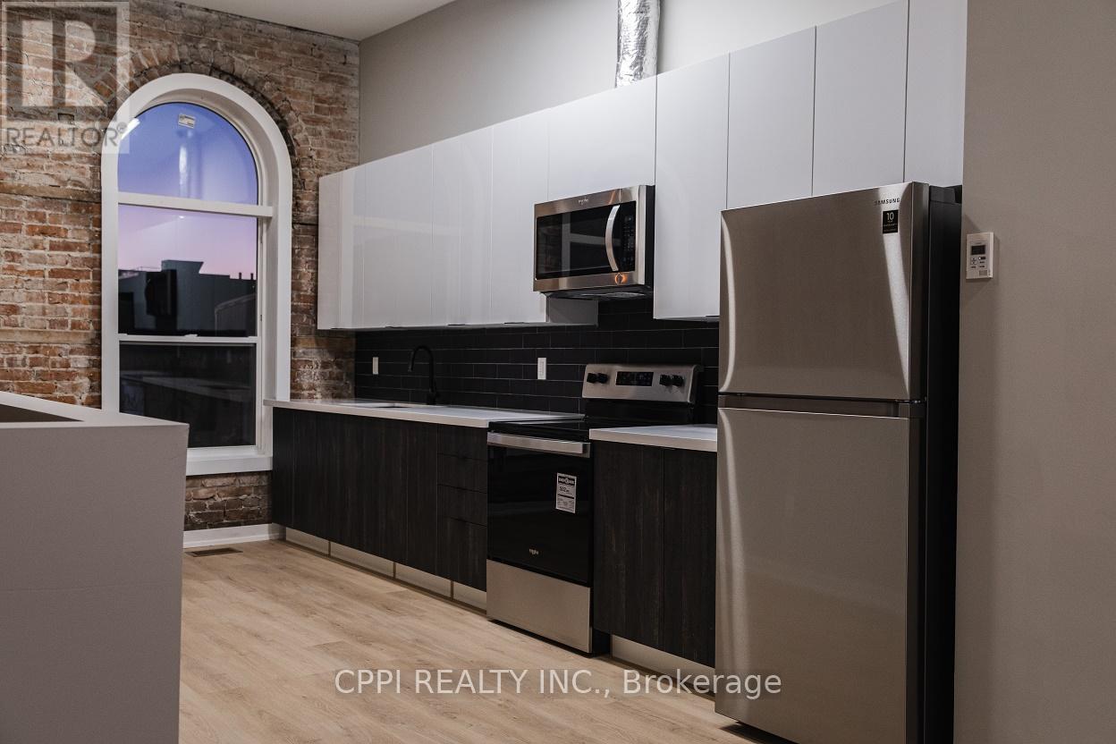 216 - 140 Simcoe Street, Peterborough Central (North), Ontario  K9H 2H5 - Photo 1 - X12050592