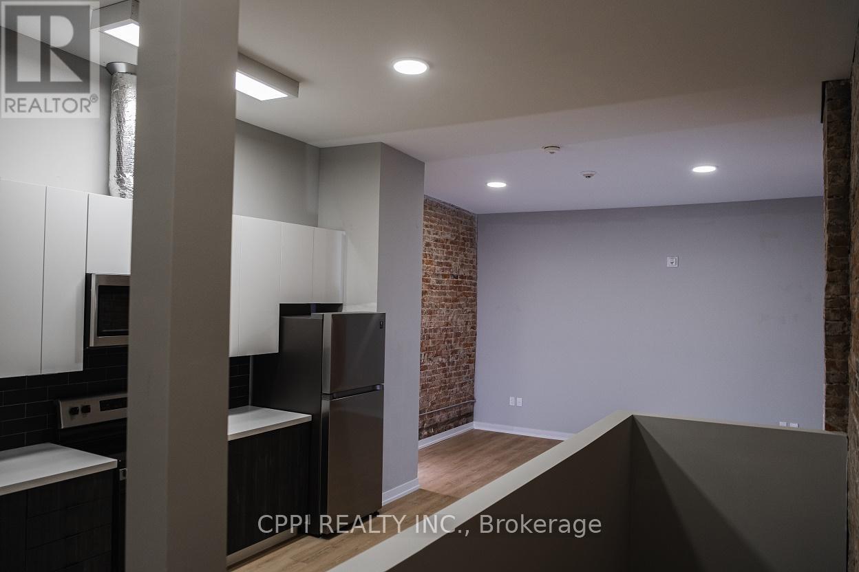 216 - 140 Simcoe Street, Peterborough Central (North), Ontario  K9H 2H5 - Photo 4 - X12050592