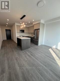 409 - 195 Hunter Street, Peterborough Central (North), Ontario  K9H 0K6 - Photo 2 - X12255634