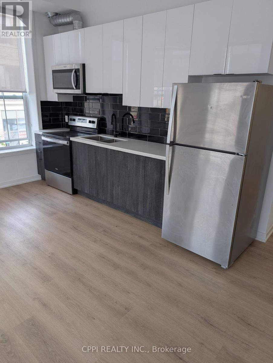 212 - 140 Simcoe Street, Peterborough Central (North), Ontario  K9H 2H5 - Photo 2 - X12356236