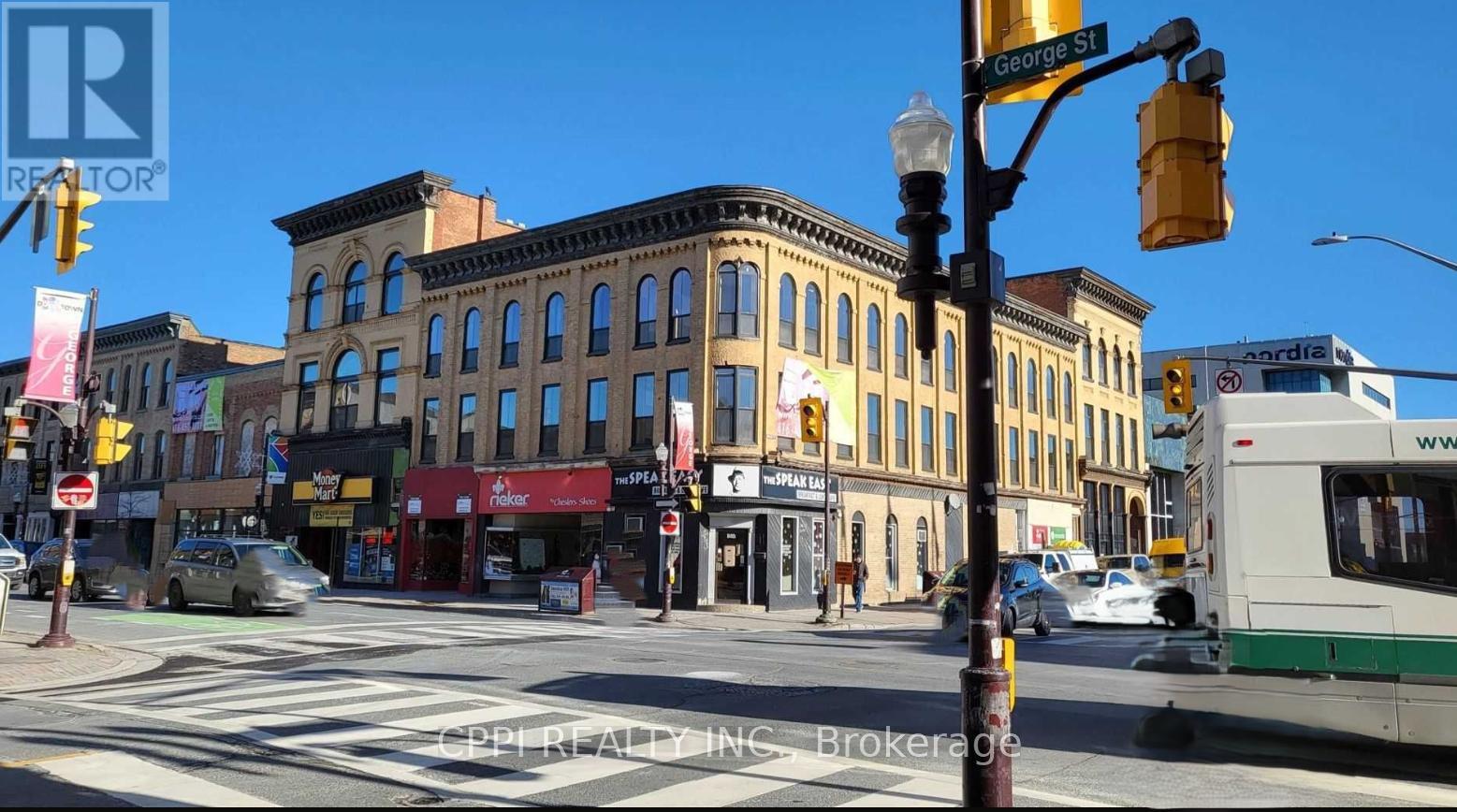 202 - 140 Simcoe Street, Peterborough (Town Ward 3), Ontario  K9H 0K5 - Photo 2 - X12515180