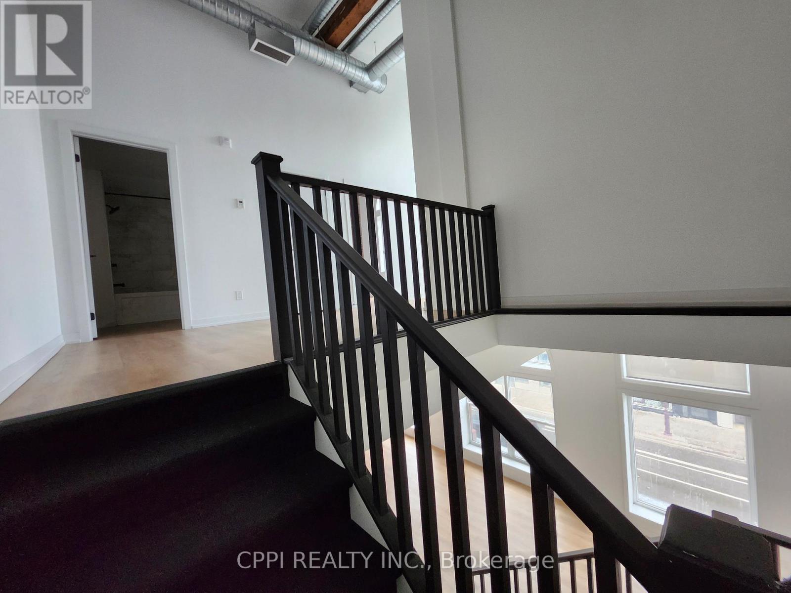 201 - 140 Simcoe Street, Peterborough (Town Ward 3), Ontario  K9H 0K5 - Photo 3 - X12608744