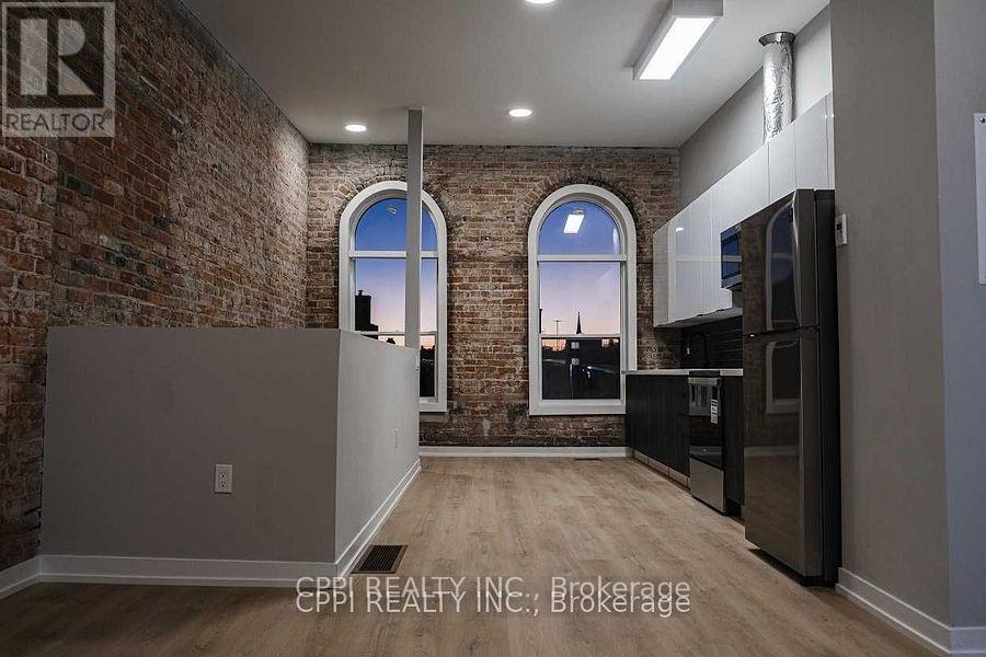 216 - 140 Simcoe Street, Peterborough (Town Ward 3), Ontario  K9H 0K5 - Photo 3 - X12664964