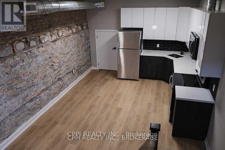 103 - 140 Simcoe Street, Peterborough (Town Ward 3), Ontario  K9H 0K5 - Photo 3 - X12664970