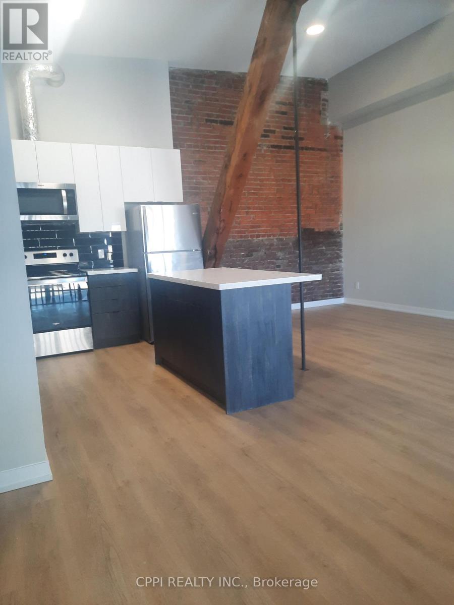 203 - 140 Simcoe Street, Peterborough (Town Ward 3), Ontario  K9H 0K5 - Photo 2 - X12856816