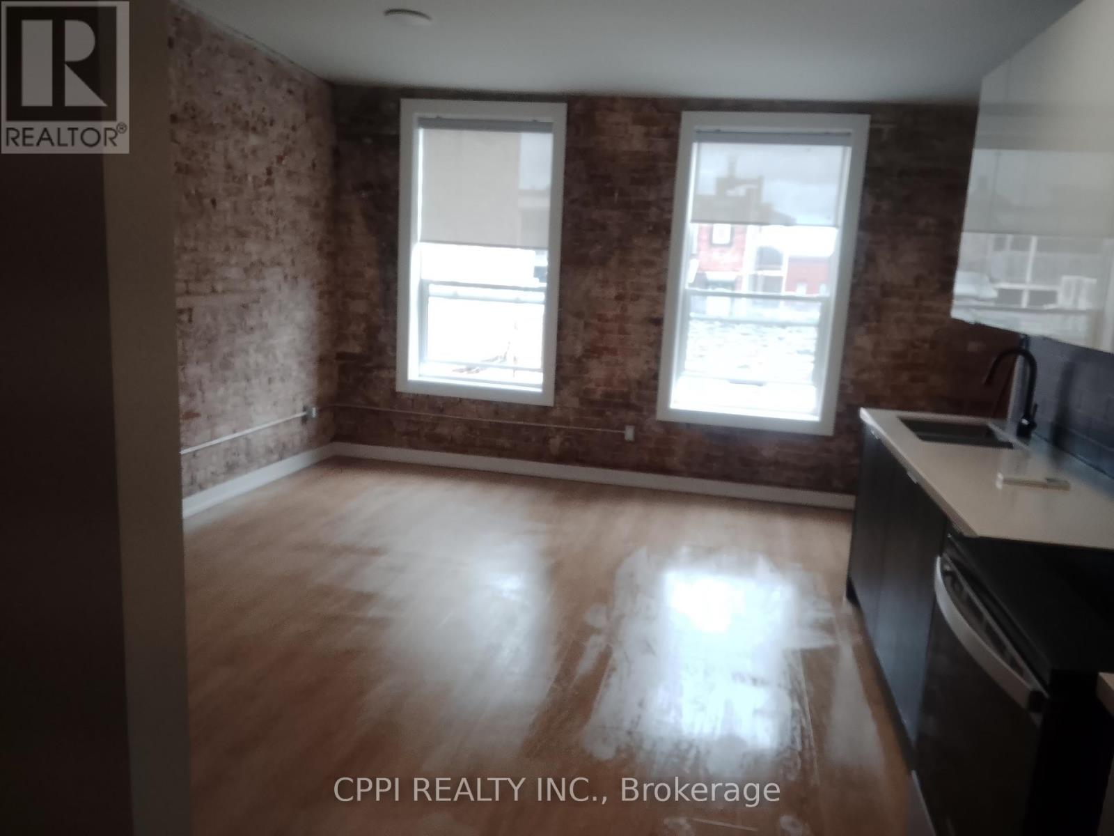 310 - 140 Simcoe Street, Peterborough (Town Ward 3), Ontario  K9H 0K5 - Photo 2 - X13117958
